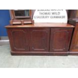 A 19th century mahogany sideboard, the top over three cupboard doors on plinth base