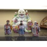 A large oriental style figurine of Buddha along with three ceramic Chinese figurines of gentlemen