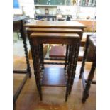 A nest of three early 20th century oak occasional tables