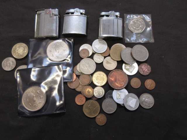 A bag containing a quantity of collector's coins, other currency, cigarette lighters, etc