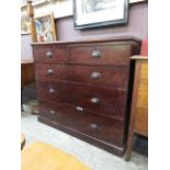 A stained pine chest of two short over three long graduated drawers