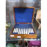 A cased set of twelve bone handled fish knives and forks