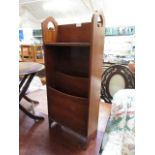 An early 20th century mahogany magazine rack