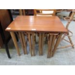 A mid-20th century occasional table incorporating four drop leaf tables under