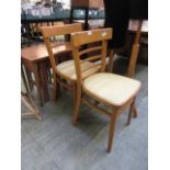 A pair of mid-20th century beech kitchen chairs