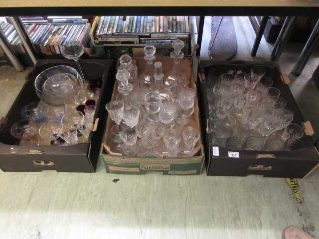 Three trays of glassware, mainly drinking vessels, bowls and decanter