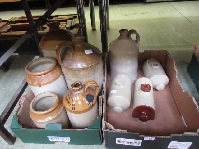 Two trays of glazed flagons and hot water bottlesNamed bottle measures 28cm in height and shows no