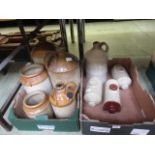 Two trays of glazed flagons and hot water bottlesNamed bottle measures 28cm in height and shows no