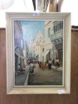 A framed oil on canvas of continental street scene