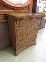 A reproduction mahogany and banded bachelor's chest, the fold over top over four long drawers