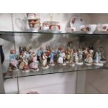 A selection of continental ceramic figures of children at play