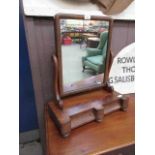 A 19th century mahogany toilet mirror with trinket drawers to base