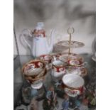 A part Royal Albert tea service comprising of tea pot, cake stand, cups and milk jug