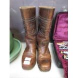 A pair of brown leather cowboy boots