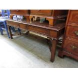 A reproduction mahogany coffee table