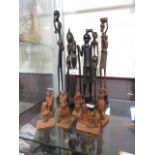 A selection of African style figures, some carved wood