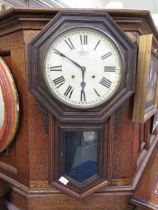 An early 20th century oak drop dial wall clock by The Ansonia Clock Co. New York