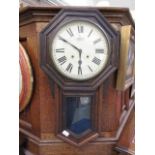 An early 20th century oak drop dial wall clock by The Ansonia Clock Co. New York