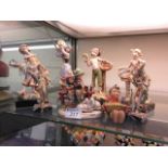 A selection of figurines to include Goebel moulded and carrara marble based figurines etc.