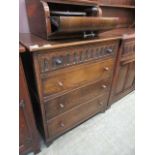 A mid-20th century oak chest of four drawers