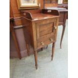 A Victorian mahogany pot cupboard having a door above single drawer on turned supports