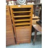 An early 20th century stationery cabinet with tamber front