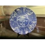 An oriental style blue and white ceramic charger