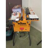 A Triton series 2000 Workcentre/table saw along with accessories