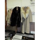 Three fur and tweed coats
