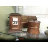 A selection of wooden desktop items to include desktop calendar, magazine rack, and a lidded oak