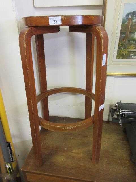 A mid-20th century bent wood stool after Alvar Alto