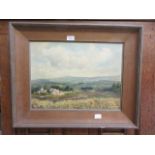 An oak framed oil on board of countryside scene signed bottom right