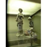 A Lladro figurine of girl with geese along with a Lladro figurine of a lady