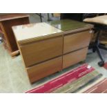 A pair of modern oak veneered bedside chests