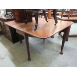 A Victorian mahogany Pembroke drop leaf table with ball and claw feet