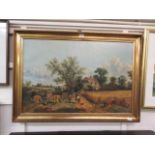 A gilt framed oleograph of harvest and cottage scene