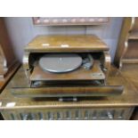 An early 20th century walnut veneer cased record player by Broadcaster