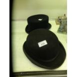 A bowler hat by Cristy's of London along with a short top hat by Wegener