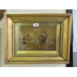 A gilt framed and glazed enhanced watercolour of couple on beach scene