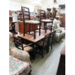An early 20th century oak refectory style dining table together with a set of four standard and