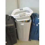 +VAT A folding laundry basket along with a two compartment laundry basket