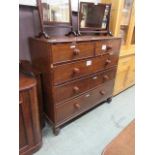 A Victorian mahogany chest of two short over three long drawers on turned bun feet