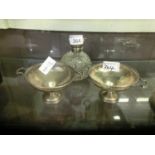 Two silver hallmarked bowls along with a silver topped perfume bottle