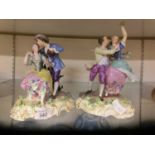 Two Staffordshire style ceramic figurines of courting couples