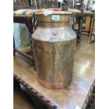 A copper milk churn with lid