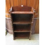 An early 20th century low level oak bookcase with barley twist columns to sides