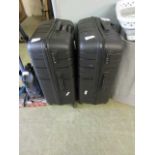 +VAT A pair of American Tourista suitcasesOne wheel damaged. One zip missing handle.