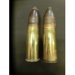 Two brass deactivated shell cases measuring 16cm