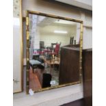 A gilt bamboo effect framed wall mirror