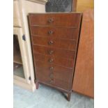 A mid-20th century mahogany eight drawer music cabinet